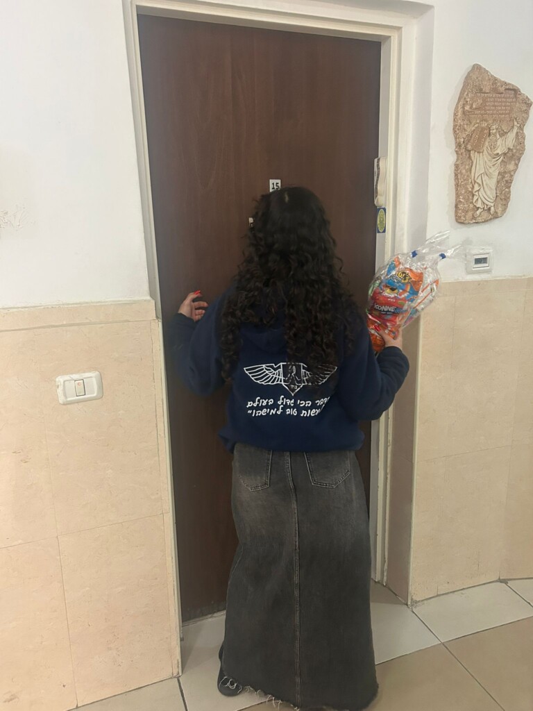 SAHI volunteer delivering food to a family in need